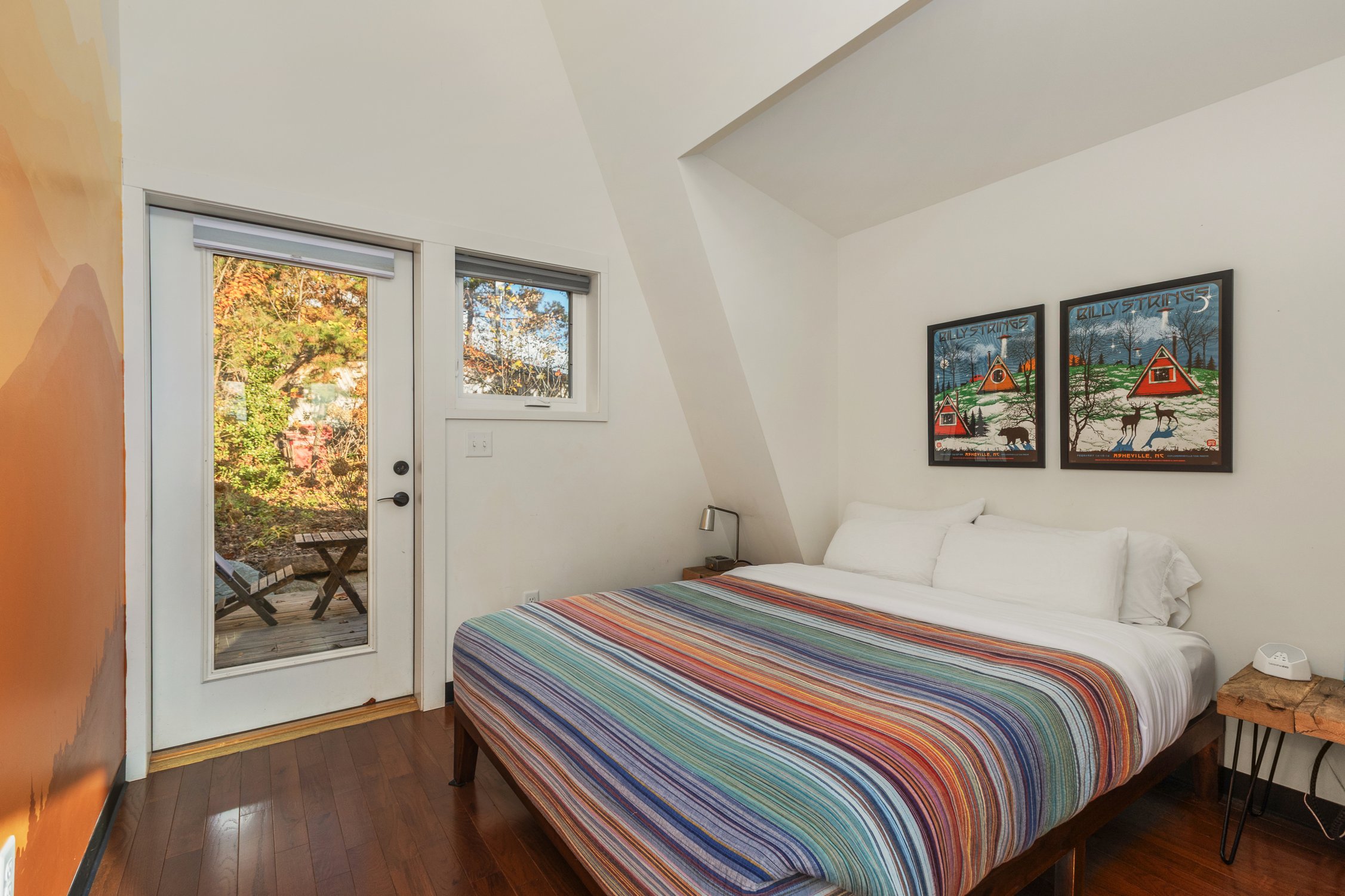 Queen bed in an A-frame cabin bedroom